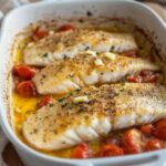 Baked Whiting Fish Recipe: Simple, Flavorful, and Easy 15 Oven-baked whiting fish fillets with cherry tomatoes, garlic, and herbs in a white baking dish — a flavorful and easy whiting fish recipe perfect for a healthy dinner.