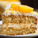 Delicious mandarin orange cake recipe with fresh mandarin slices and creamy frosting