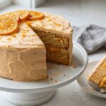 Best orange creamsicle birthday layer cake sliced showing two layers and orange curd filling