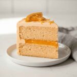 Best orange creamsicle birthday layer cake slice showing orange curd stripe between two layers