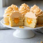Orange Creamsicle Cupcakes with orange filling and vanilla frosting